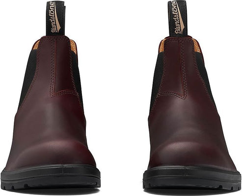 Pair of reddish brown leather boots with black elastic sides and black soles, showing the front view.