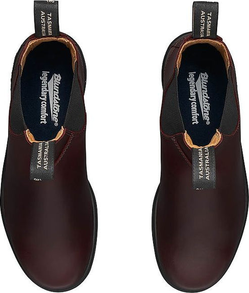 Pair of leather burgundy-colored Blundstone boots, top view showing elastic sides and insole details.