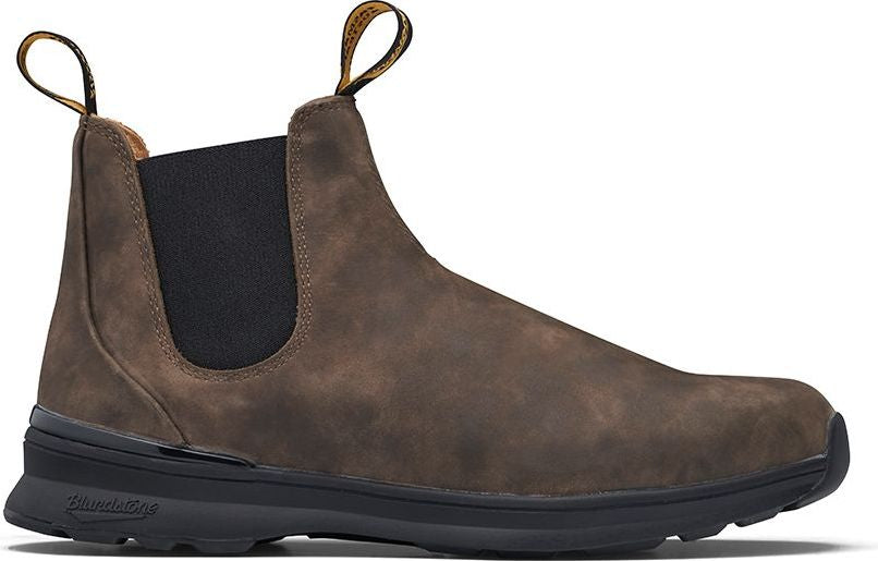 A brown suede ankle boot with black elastic side panels and heel pull tab, showcasing its side profile.