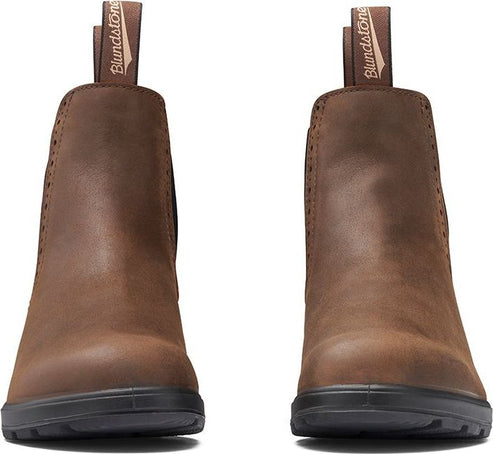 Pair of brown ankle boots with black soles and pull tabs.
