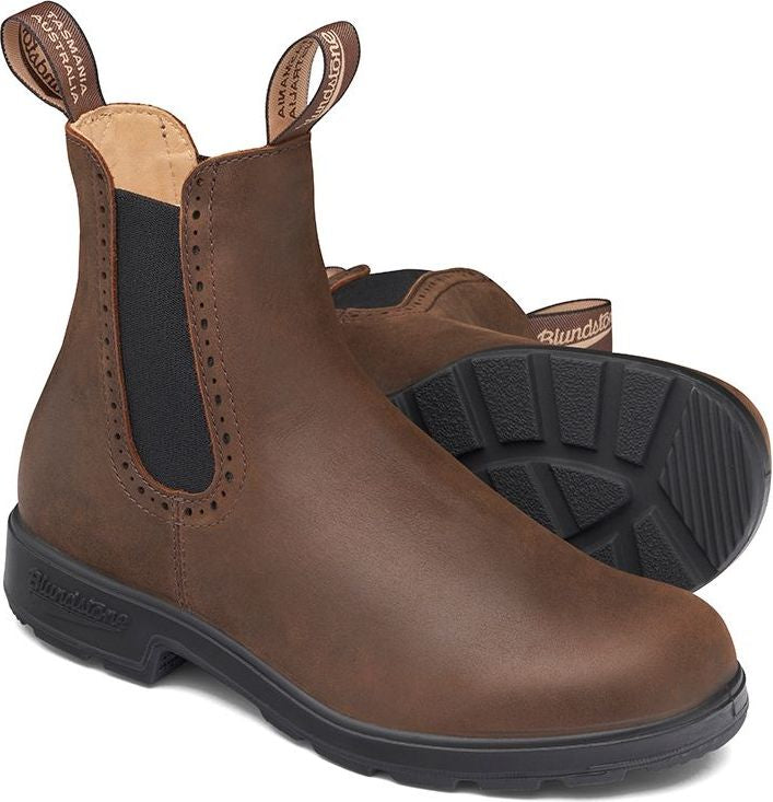 A pair of brown leather ankle boots with elastic side panels and pull tabs.