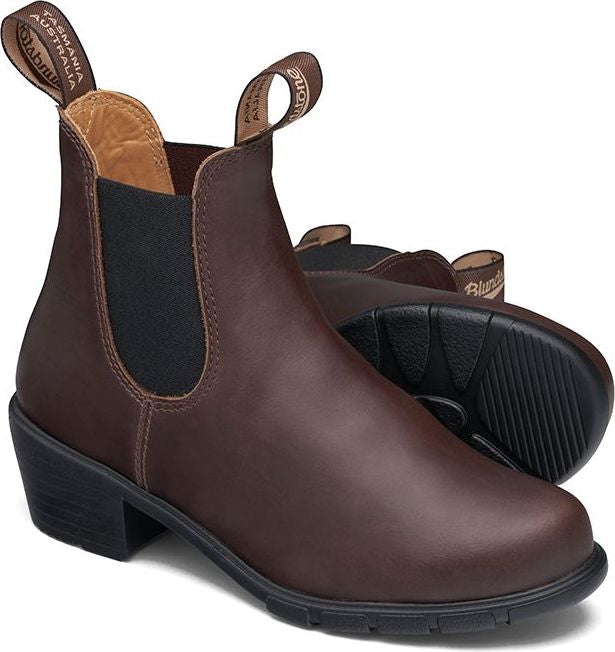 A pair of dark brown leather Chelsea boots with elastic side panels and a block heel.