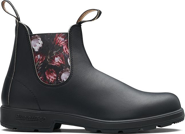 Black leather ankle boot with floral print panel.