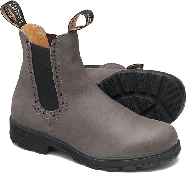 Pair of gray leather Chelsea boots with elastic side panels, decorative perforated edges, and pull tabs.