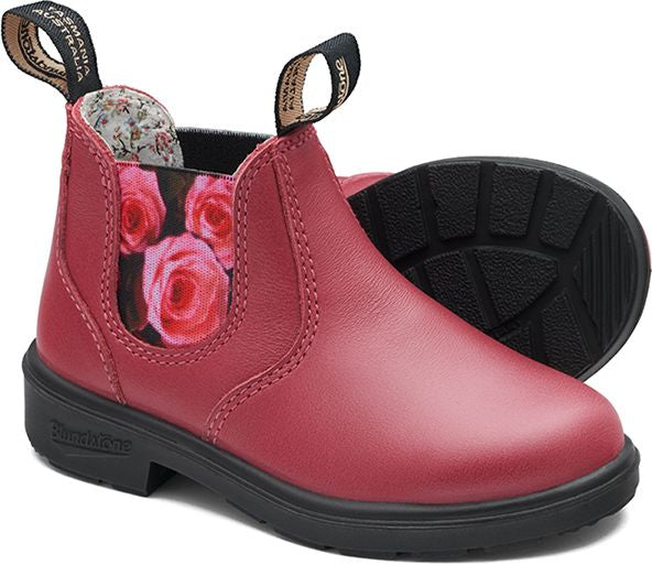 Reddish-pink leather boots with elastic side panels featuring rose print, black soles, and fabric interior.