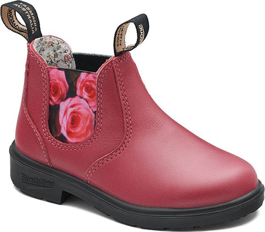 Reddish-pink leather boot with elastic side panel featuring roses print, black sole and black and white pull tabs.