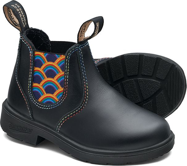Black Chelsea-style boot with rainbow wave patterned elastic side panels and decorative rainbow stitching.