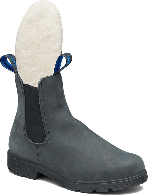 Gray Chelsea boot with an insole pulled up, showing faux fur lining.