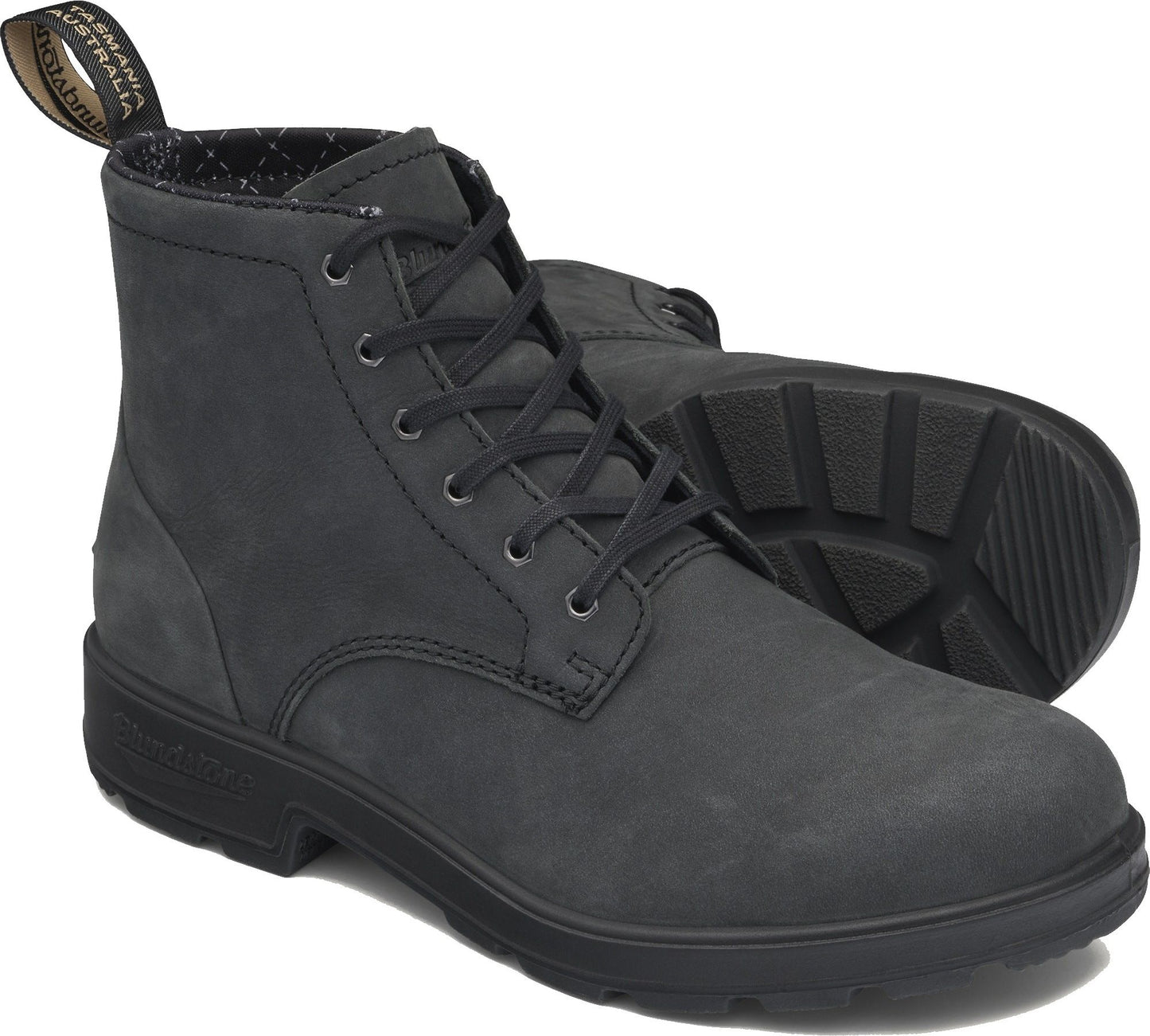 Black ankle-high lace-up boots with a textured rubber sole and a looped pull tab at the back.