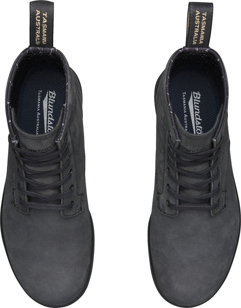 Two black leather boots, top view.
