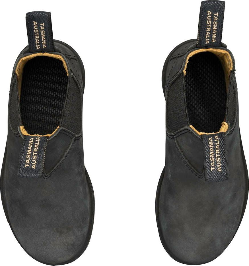 Top-down view of two black leather boots with elastic sides and pull tabs labeled "TASMANIA AUSTRALIA".