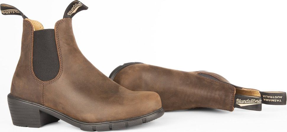 A pair of brown leather heeled ankle boots.