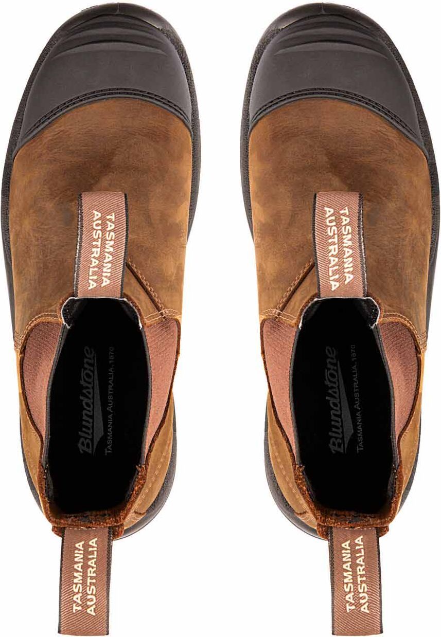 Top-down view of a pair of brown leather slip-on boots with dark brown toe caps and elastic side panels, pull tabs on the front and back read "TASMANIA AUSTRALIA".