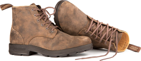 A pair of brown leather lace-up boots with a dark brown sole.