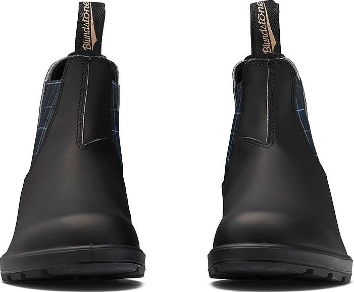Front view of two black pull-on boots with black pull tabs and blue plaid elastic inserts.