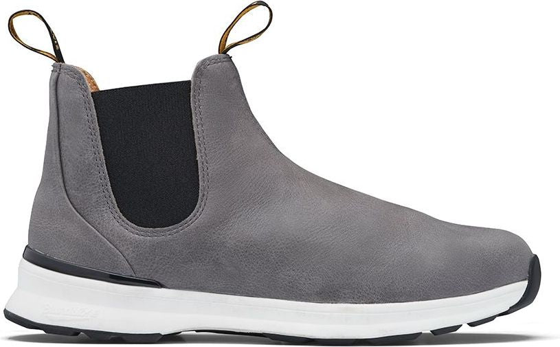 Gray ankle boot with black elastic side panels, a white midsole, and black sole.