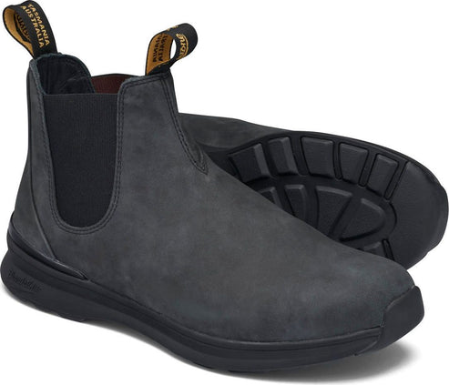 Gray ankle boots with black elastic sides and black soles. "Tasmania Australia" is printed on pull tabs.