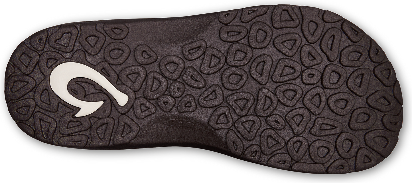 Dark brown sandal sole with triangular and circular tread and a white hook-shaped emblem.