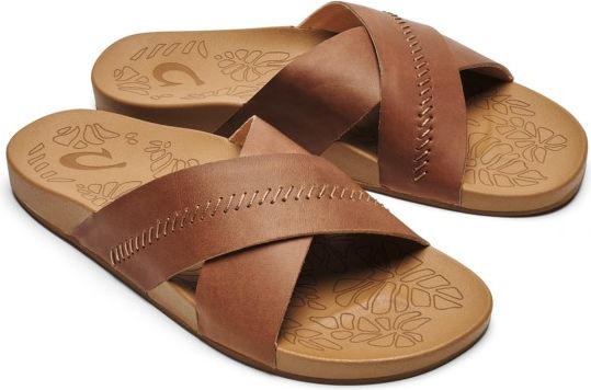 Pair of light brown slide sandals with crisscross leather straps.