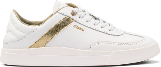 A white sneaker with gold accent.