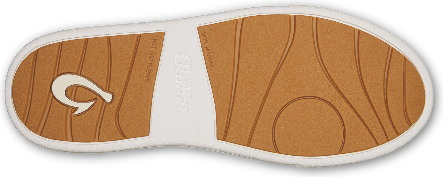 Shoe sole with textured tan tread.