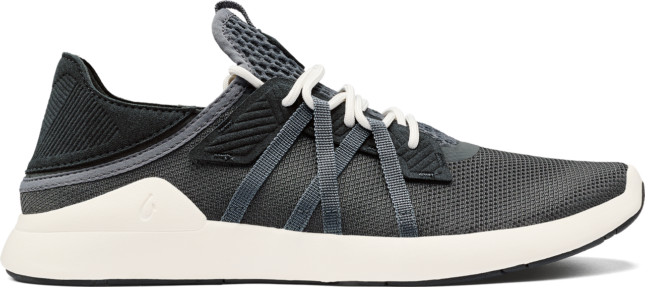 A gray athletic shoe with white laces and a white sole.