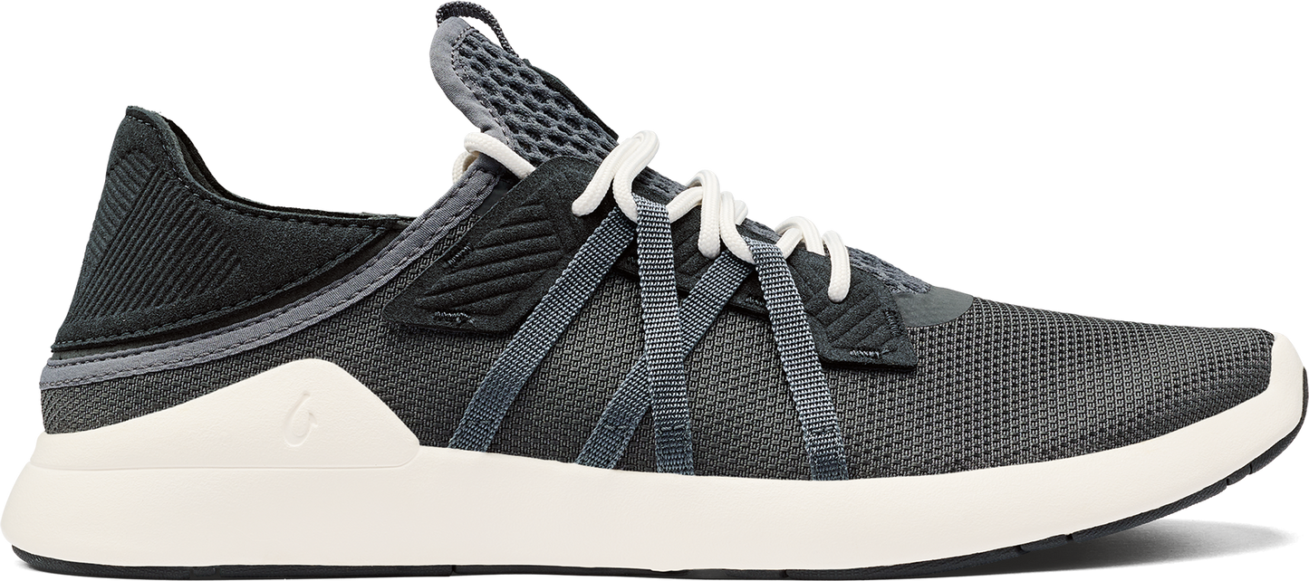 A gray athletic shoe with white laces and a white sole.