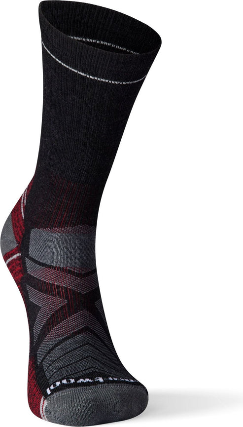 Close-up of a sock that is primarily black on the top half and transitions into a geometric grey and red pattern on the lower half.