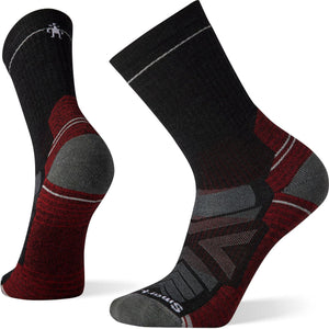 Pair of black hiking socks featuring reinforced toe and heel, accented with red and gray stripes.
