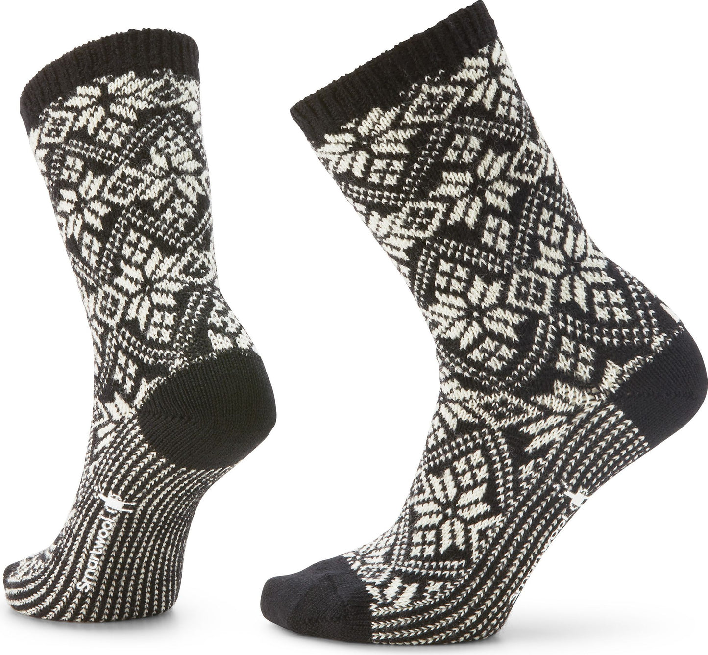 Two black crew socks with white snowflake pattern.