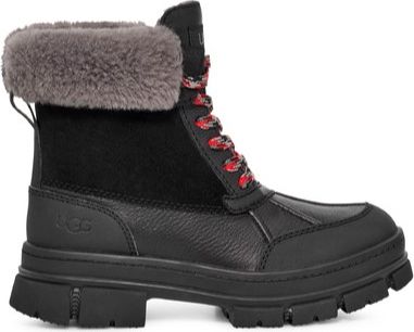 Black ankle boot with faux fur collar, a dark rugged sole, and red-accented laces.