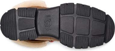 The bottom view of a shoe with black rubber outsoles and treads.