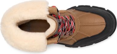 A brown leather boot with fur lining and red and white patterned laces.