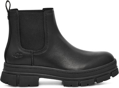 Black Chelsea boot with a lug sole and elastic side panels.
