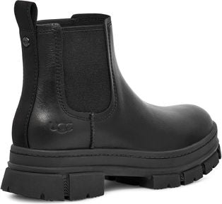 Black leather Chelsea boot with pull tab and thick lug sole.