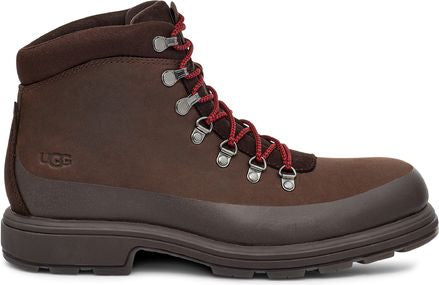 Brown high top hiking boot with red laces and metal eyelets.
