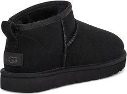 Low-cut black suede boot with a rubber sole and a pull tab at the back, and a square logo on the heel.