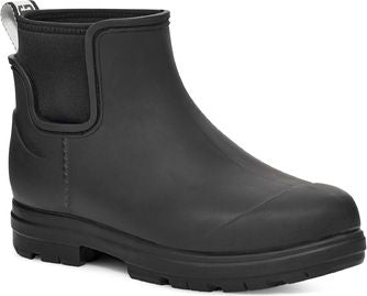 A black rubber Chelsea boot with a rounded toe and a thick treaded sole.