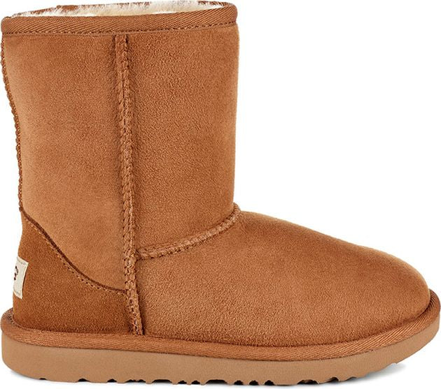 Chestnut-colored UGG boot with a rounded toe and a flat sole.