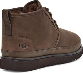 Dark brown suede chukka boot with visible laces and UGG logo.