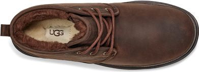 An UGG brown leather shoe, lined with fur and laced up.