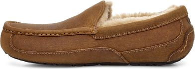 A brown leather loafer with a fur lining.