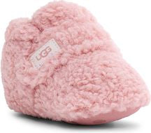 Pink baby bootie with UGG logo on side tag.