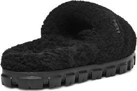 Black fuzzy slip-on shoe with lug sole.