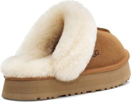 Tan suede slipper with thick cream-colored faux fur lining.