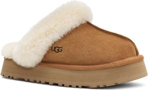 Brown slipper with cream-colored fur trim and 'UGG' logo.