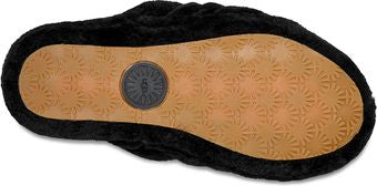 The sole of a black slipper with UGG logo.