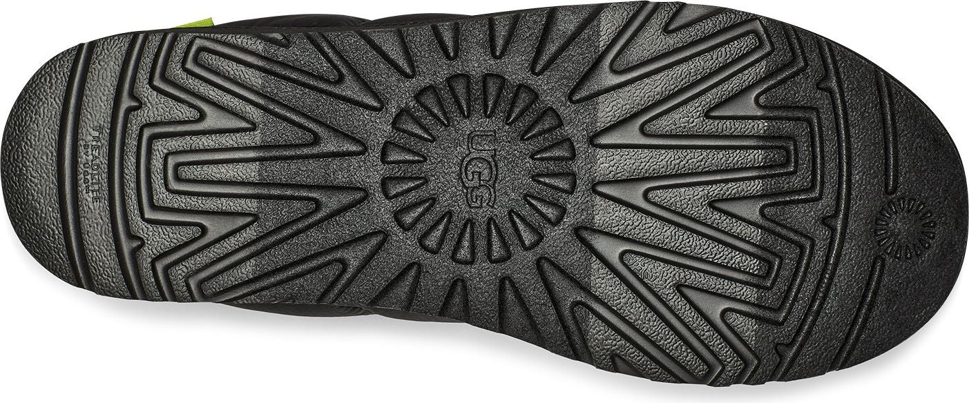 The black lug outsole has a tread pattern with UGG logo at center.