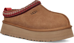 Tan suede slip-on platform shoe with a decorative red band and a red pull tab.